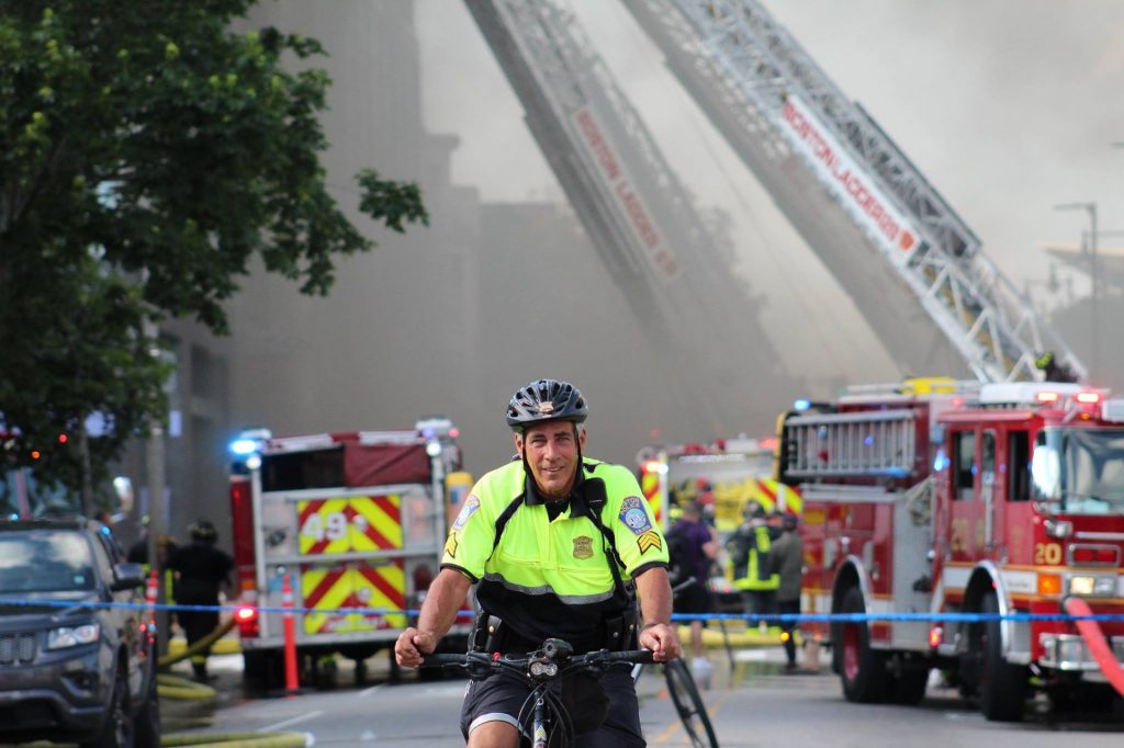 Officer on bicycle in reflective shirt